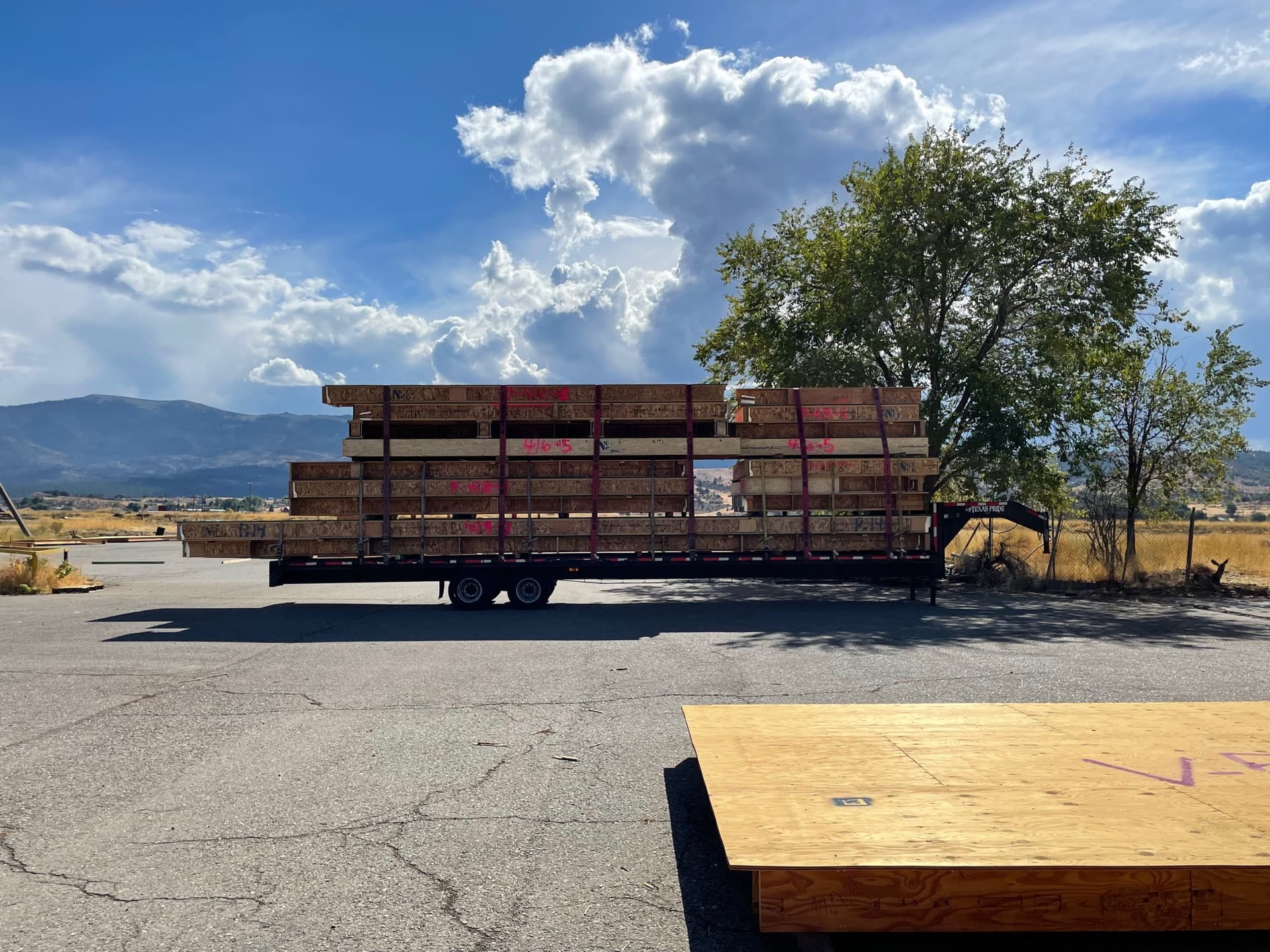 Loaded trailer with dramatic cumulus clouds