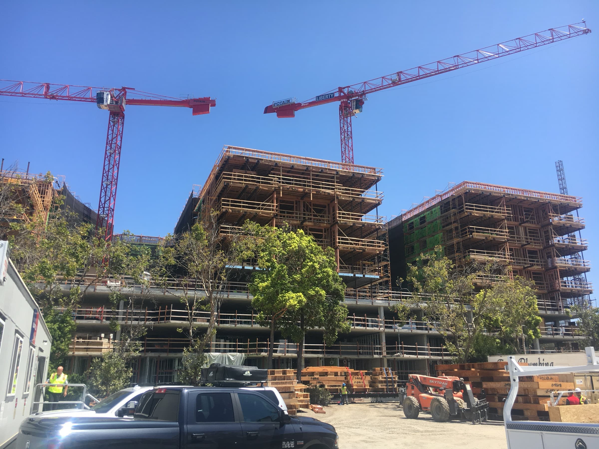Jack London Square construction with three red tower cranes