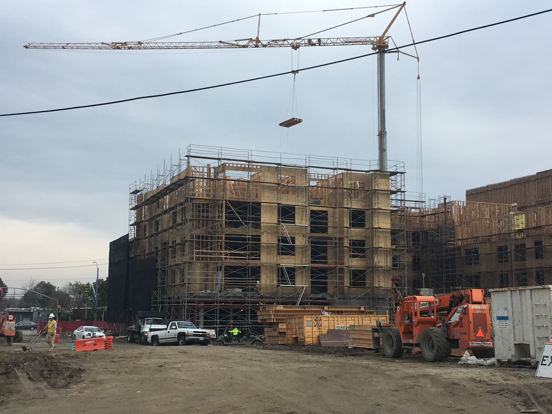 Cassette panel suspended mid-air from crane