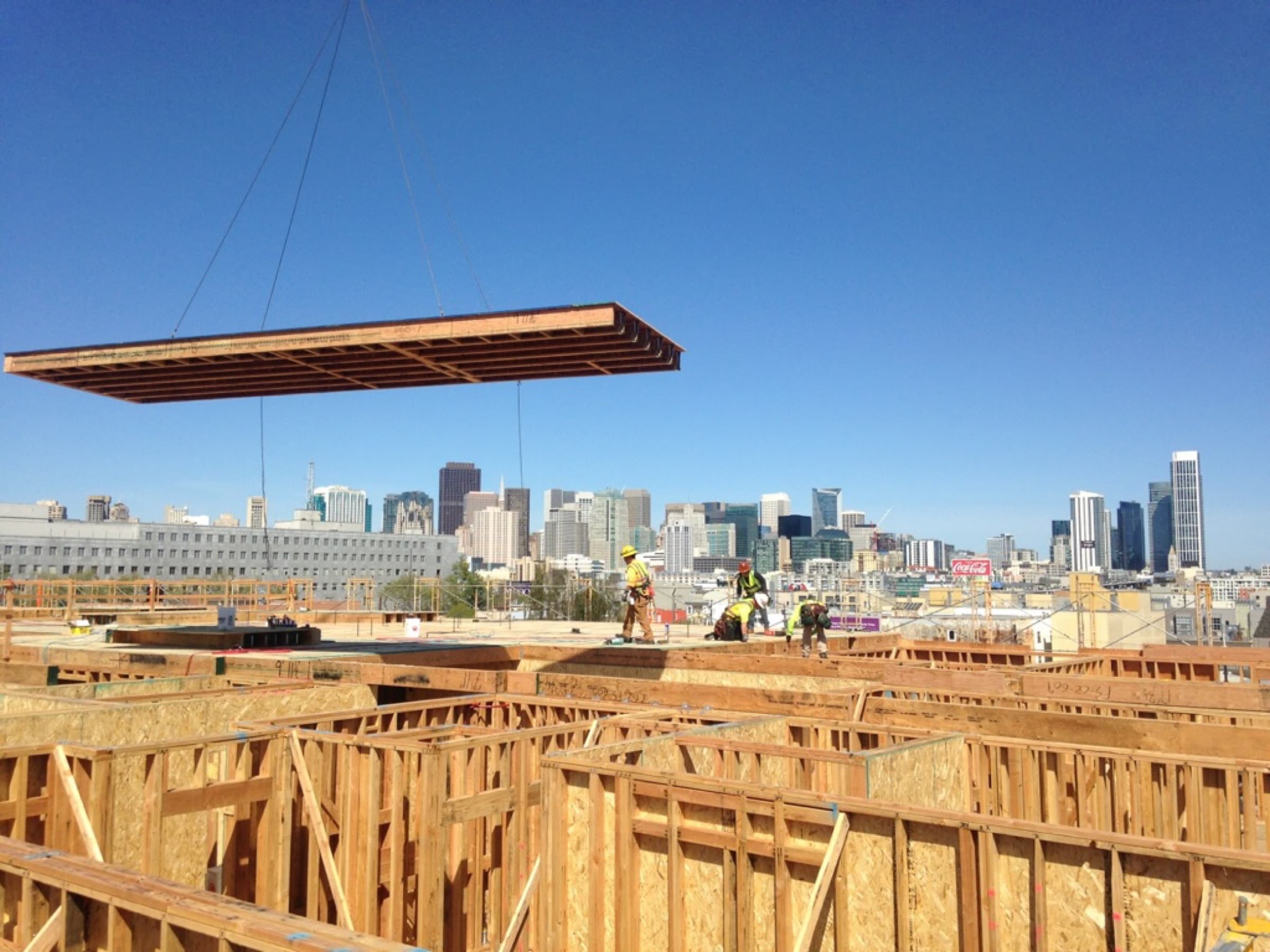 NCC floor cassette being crane-set into position with San Francisco skyline